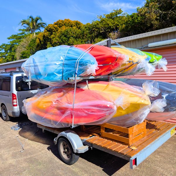 Services 11 Kayaks loaded on a trailer ready for delivery