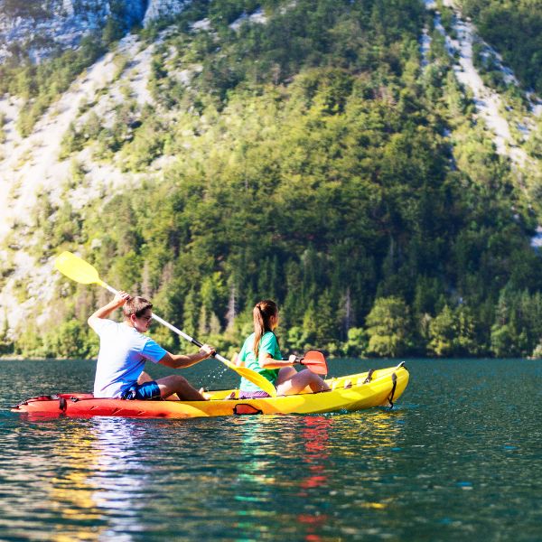 Services 6 Group kayaking through a scenic gorge or river