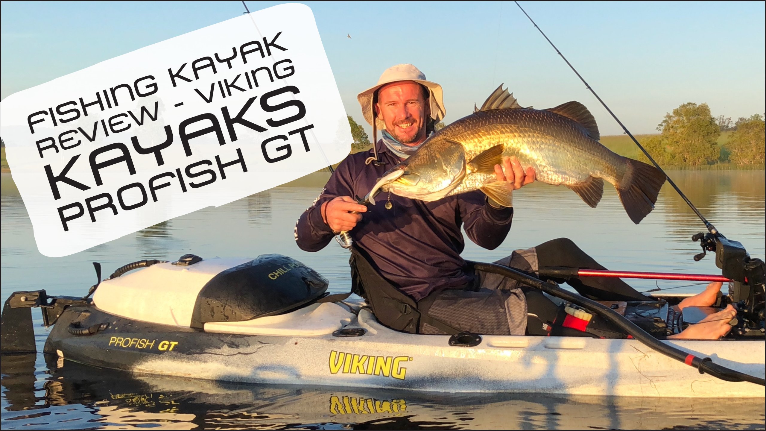 Kayak angler, paddle guy, jason milne holding a large barramundi on viking profish gt kayak