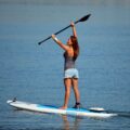 Bixpy K-1 motor mounted on stand-up paddleboard in calm water