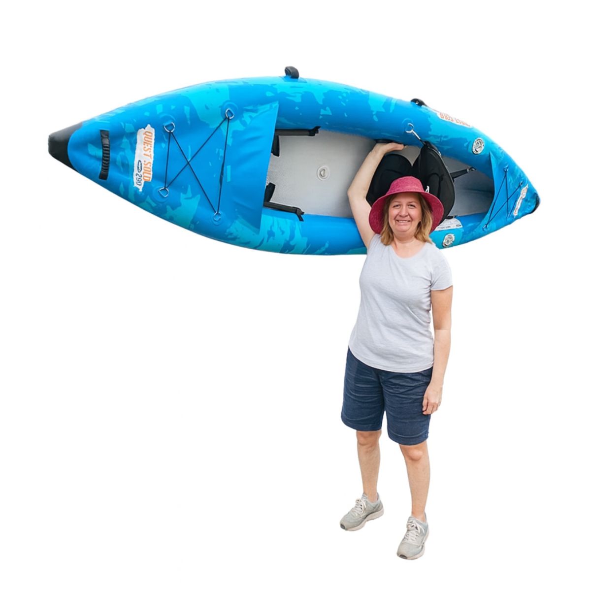 Middle-aged woman holding the jaspara quest solo inflatable kayak above her head – lightweight and easy to carry.