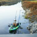 “Angler fishing from a Native Slayer Propel 10 LTE on a calm river”,