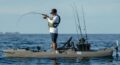 Angler fishing offshore from a Bonafide PWR129 kayak equipped with rods and gear.