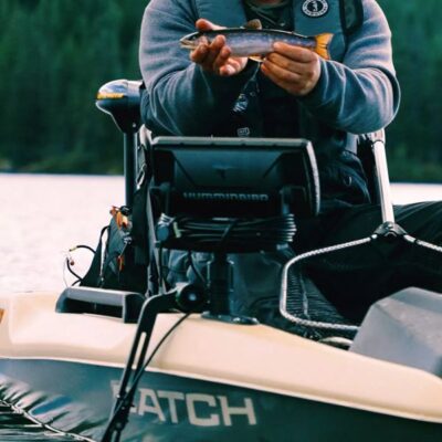 Angler using rigging tracks on the Pelican Catch PWR 100 to mount electronics and fishing accessories