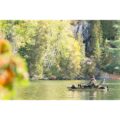 Angler fishing from Pelican Catch 110 HDII pedal kayak on sheltered water
