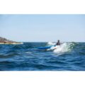 Point 65 Whisky 16 surfing waves near rocky coastline
