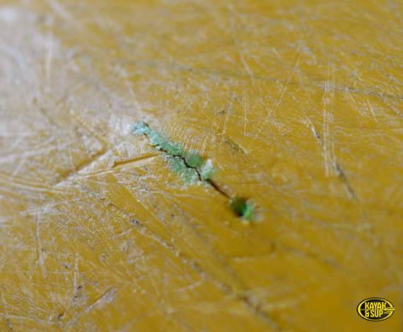 Structural crack in plastic kayak hull – example of a deal-breaker defect